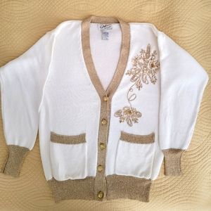 White cardigan embellished with gold.